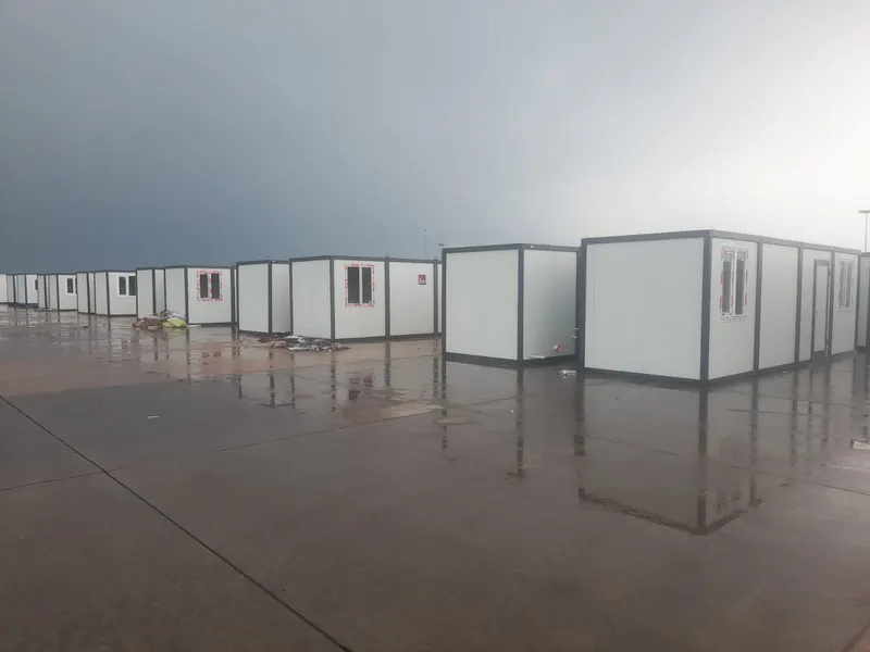 A long row of B2KON units on a paved site