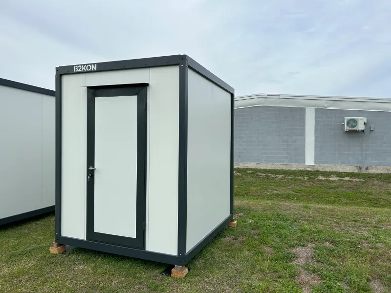 UNIMOD 6.5 by 8 foot storage cabin with a lockable steel door